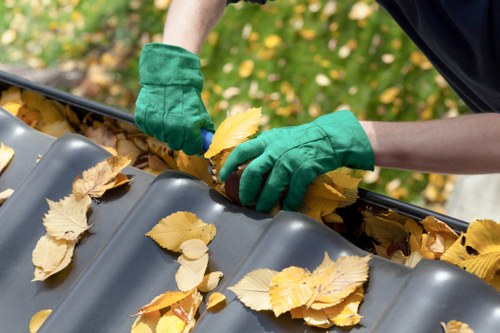 Operator securing a skip load before transport