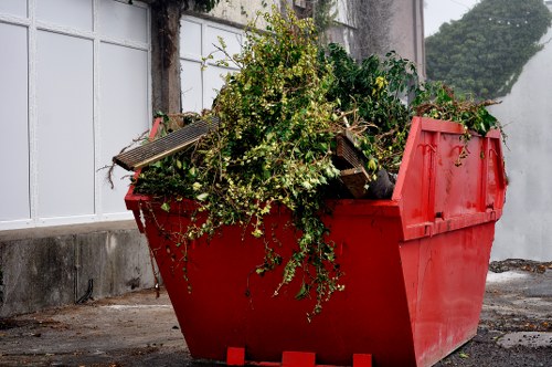Dulwich skip hire truck delivering a skip